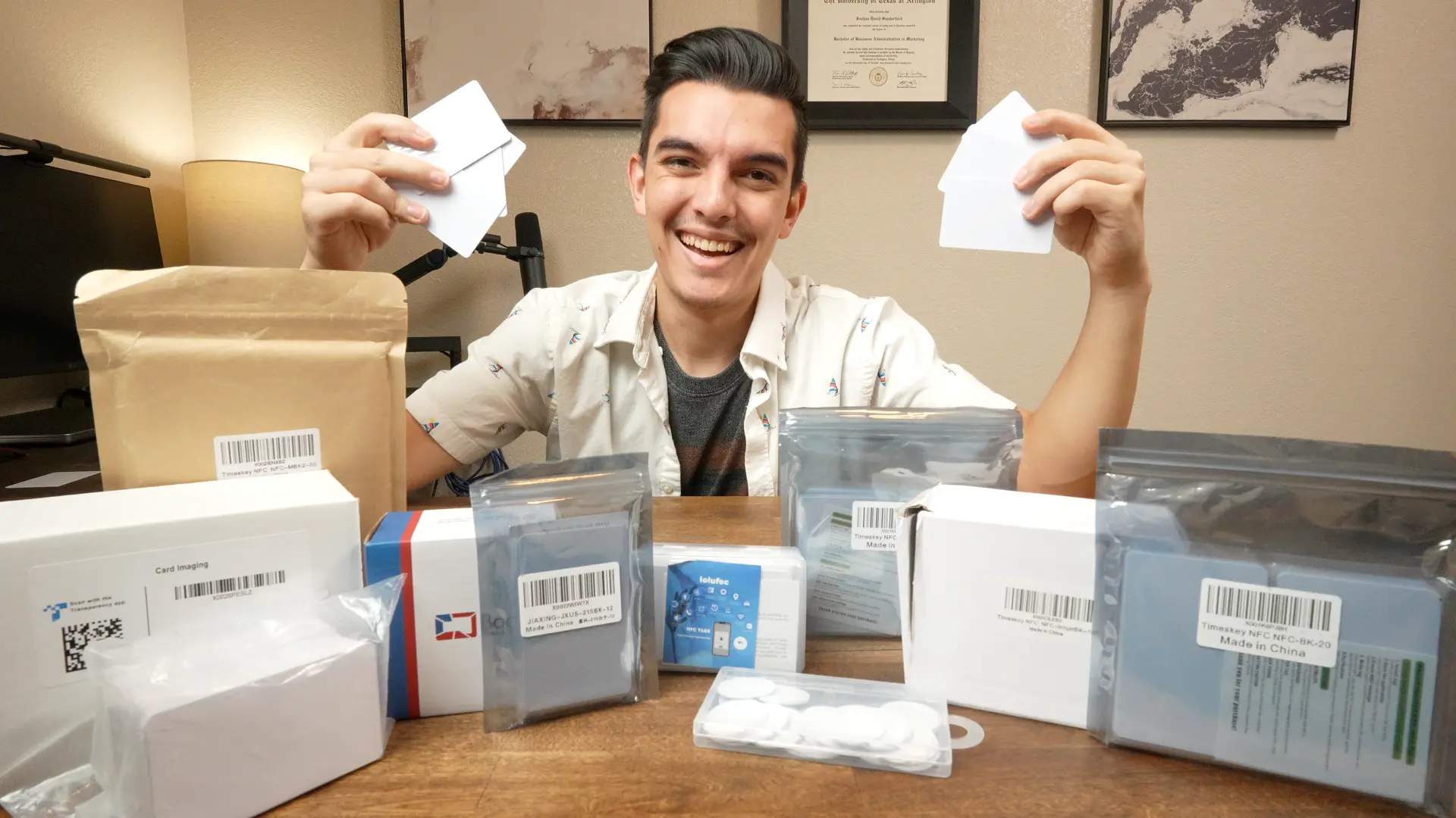 Joshua Sanderford holding blank NFC cards